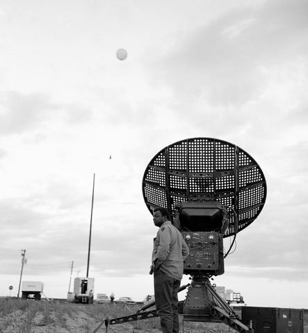 Hail project, New Raymer, man in front of equipment (1073-018)