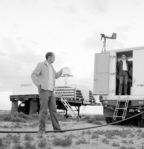 Hail project, New Raymer, 2 men with trailer and equipment in the field (1073-019)